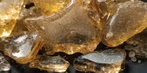 Golden Cannabis Shatter Concentrate Macro