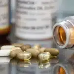 Cannabis oil and antibiotics placed together, highlighting potential combined use.