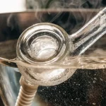 Glass Cannabis Smoking Pipe with Water and Smoke