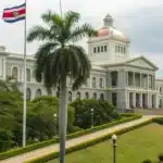 Realistic view of a Costa Rican legislative building with official documents on Costa Rica Laws on Weed.