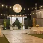 Realistic view of a weed bar at a wedding reception showcasing modern decor and cannabis displays.