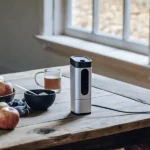 digital brix meter on wooden table next to apples