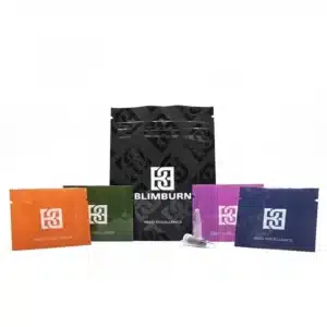 Blimburn Seeds cannabis seed packaging with branded pouches and colorful vials arranged on a clean white studio background.