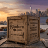 Blimburn Seeds USA expansion shipping port scene with a branded crate, cargo containers, and sunset skyline background.