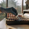 Gloved scientist placing a test tube into a laboratory analyzer for cannabis sample testing