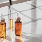 Glass vials filled with golden cannabis oil samples arranged on a laboratory table under natural light.