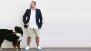 Citybiz features Blimburn Seeds U.S. expansion with Sergio Martinez standing beside a large dog against a minimalist wall.