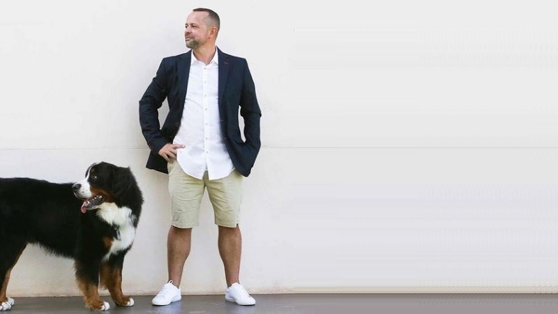 Citybiz features Blimburn Seeds U.S. expansion with Sergio Martinez standing beside a large dog against a minimalist wall.