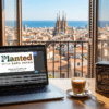 Planted Podcast Sergio Martinez on Spannabis genetics displayed on a laptop with Blimburn Seeds tin and Barcelona skyline view.