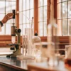 Scientist performing cannabis extraction using distillation equipment in a laboratory.