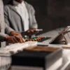 Cannabis dispensary staff organizing premium Delta 9 THC gummies at a modern retail counter.