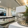Cannabis flower sample beside laboratory testing equipment and chemical bottles.