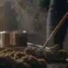 Cannabis decarboxylation process with flower material being heated and stirred during preparation.