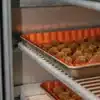 Cannabis buds arranged in a small-batch curing system designed for controlled moisture management and flower preservation.