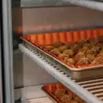 Cannabis buds arranged in a small-batch curing system designed for controlled moisture management and flower preservation.