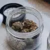 Cannabis flower samples stored in glass containers during water activity analysis and moisture testing.
