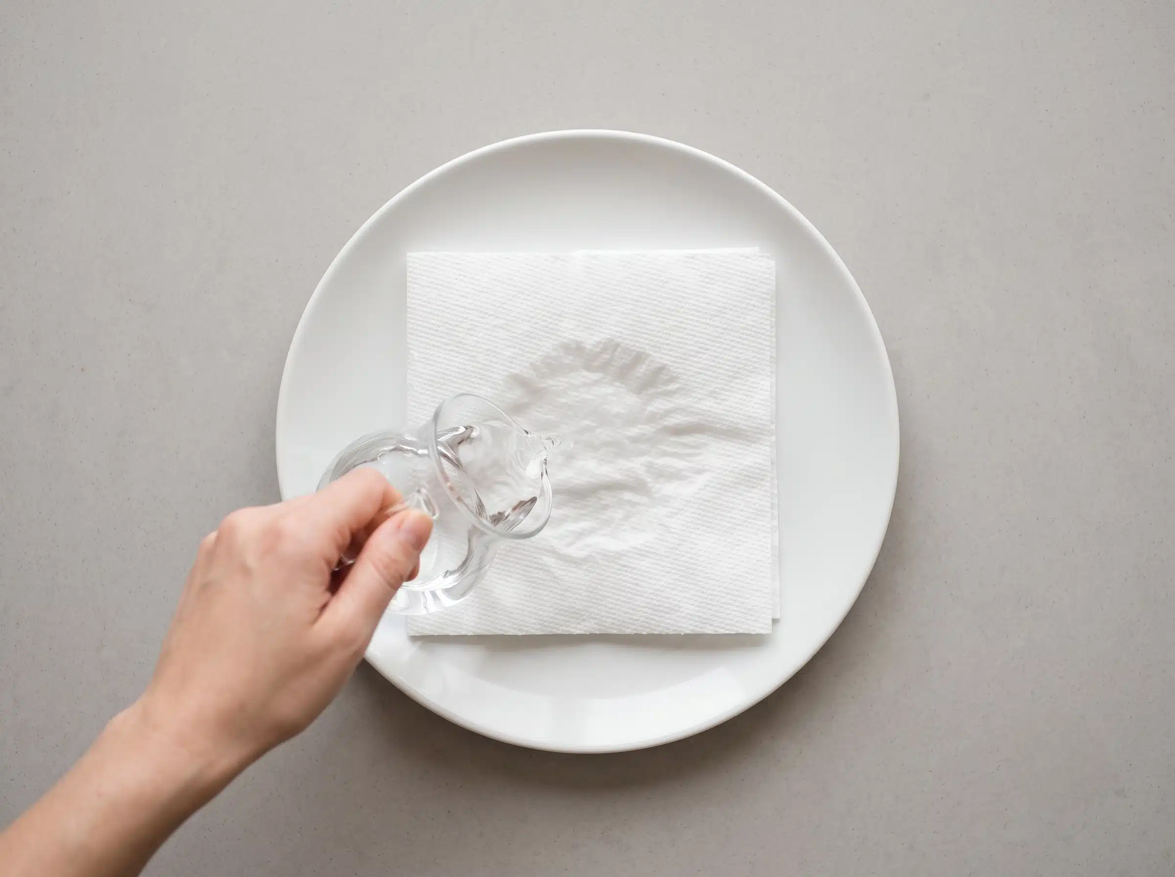 Damp paper towel being prepared