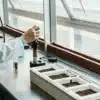 Cannabis water activity sample testing with a technician analyzing material using a laboratory probe.