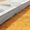 Fresh hydroseeding mulch evenly spread across a prepared planting surface.